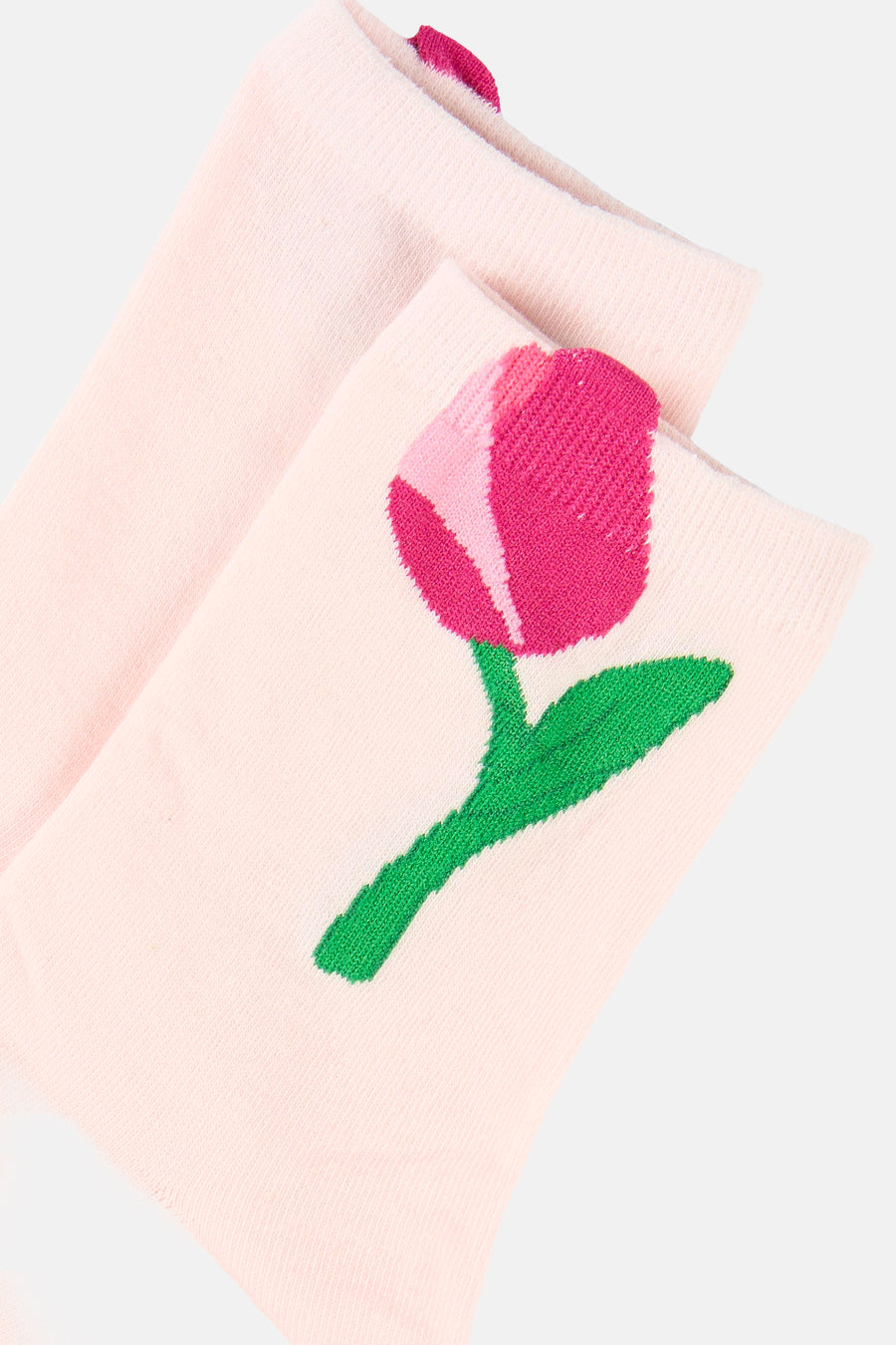 Roze sokken van PIECES® met een geborduurde roze tulp en groene steel.