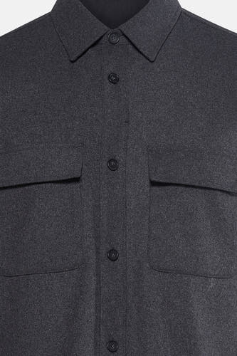 Manteau gris court de MANGO, avec fermeture à boutons et deux poches po.
