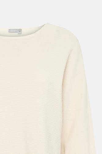T-shirt écru avec col rond en France, avec un tissu côtelé et des manches longues, en gros plan.