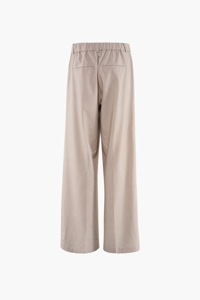 Pantalon de costume gris français, avec une ceinture élastique à l'arrière et des poches.
