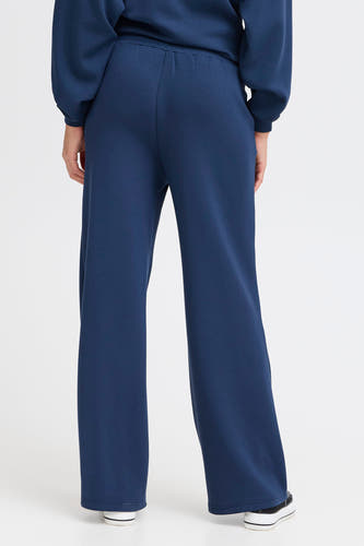 Blauwe joggingbroek van Fransa, gezien van achteren, met een losse pasvorm en elastische tailleband.