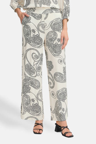 Pantalon écru de France, avec imprimé paisley et larges pinces.
