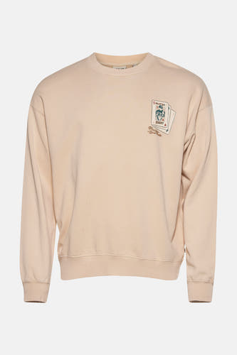 Gilet écru de SOLID, avec une impression de cartes à jouer sur l'avant.