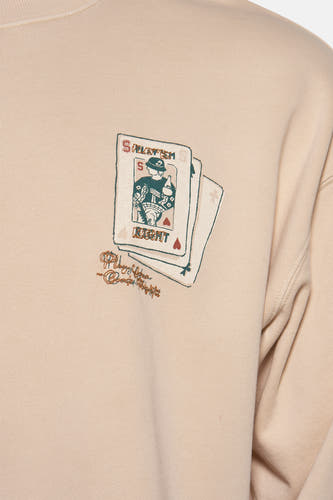 Ecru sweater van SOLID, met een opdruk van speelkaarten op de voorkant.
