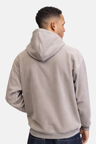 Gilet beige avec capuche de REDEFINED REBEL, vue arrière d'une personne portant des jeans foncés.