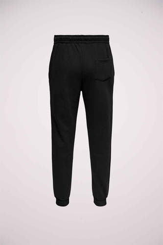 Pantalon de jogging noir d'ONLY & SONS, avec une poche arrière et des chevilles élastiques.