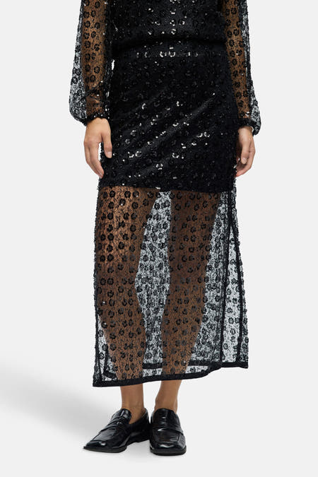 Longue jupe noire d'OBJECT, avec un motif floral transparent et une coupe élégante et ajustée.