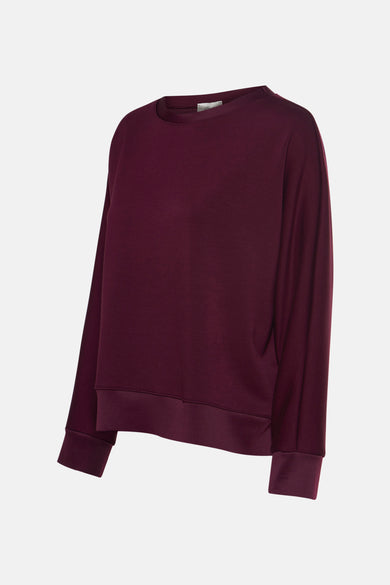 Gilet de couleur bordeaux avec des manches longues de Terra di Siena, avec un col rond et des bordures côtelées.