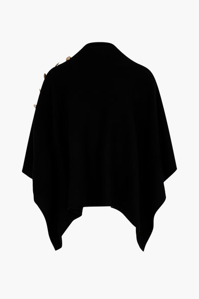 Poncho noir de Morgan De Toi avec des boutons dorés sur les épaules, vu de derrière.