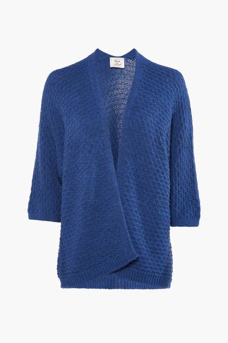 Veste bleue de Terra di Siena, avec une texture grossièrement tricotée et un motif subtil.