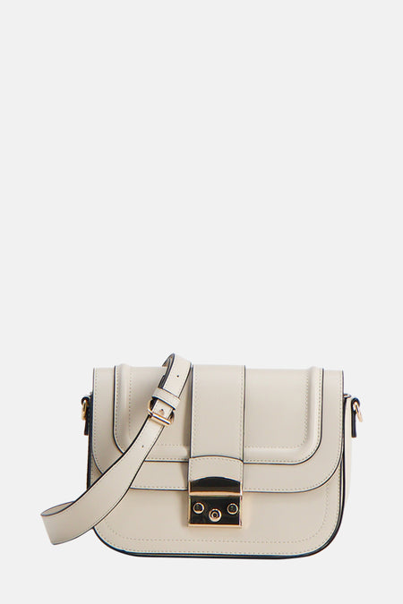 Sac bandoulière beige de Morgan de Toi, avec une sangle d'épaule ajustable et des bords noirs.