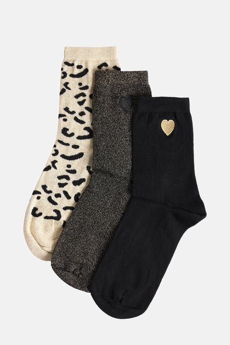 Chaussettes multicolores de Morgan De Toi, avec imprimé léopard, texture pailletée et chaussette noire avec détail de cœur doré.