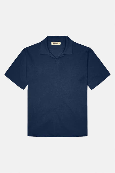 Polo bleu à manches courtes de WOODBIRD, en tissu uni avec col ouvert.