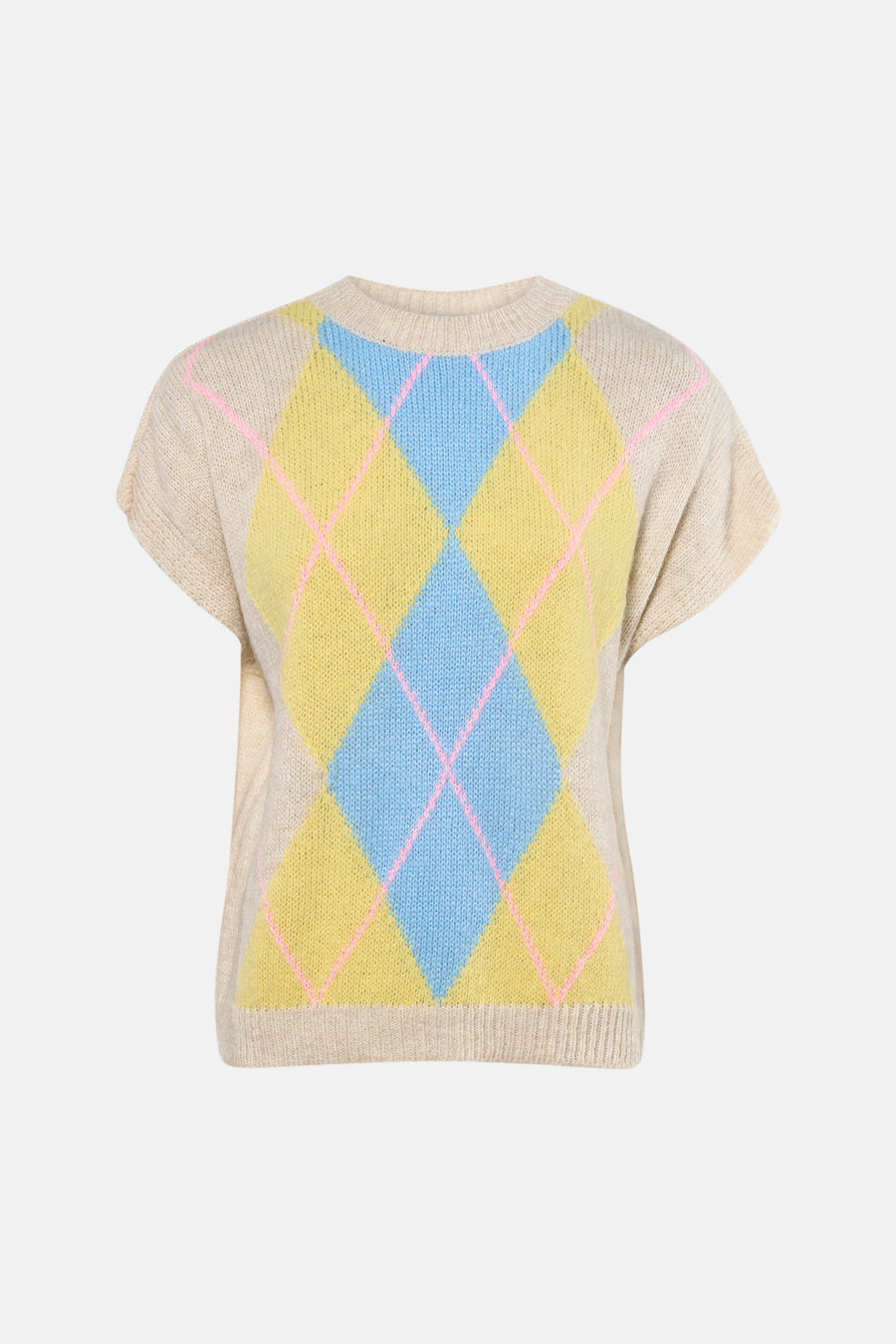 Gilet sans manches beige de Terra di Siena, avec un motif losange argyle bleu et jaune, porté sur un jean à jambes larges et des escarpins marron.