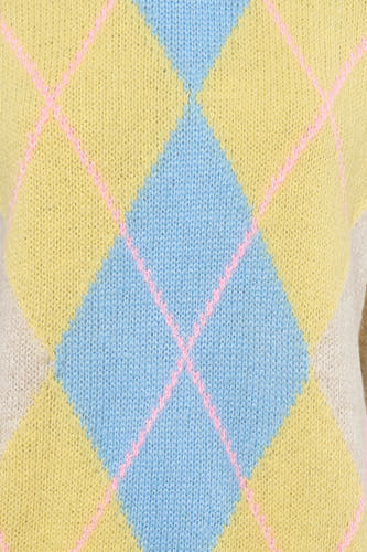 Gilet beige sans manches de Terra di Siena, avec motif à carreaux bleu et jaune avec des lignes roses.