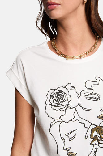 T-shirt blanc à manches courtes de Morgan De Toi, avec impression de visages et de roses.