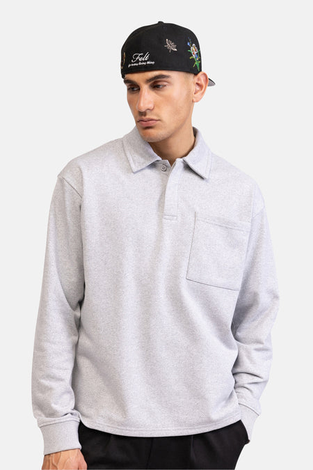 Pull gris de REDEFINED REBEL, avec manches longues, col polo et poche poitrine.