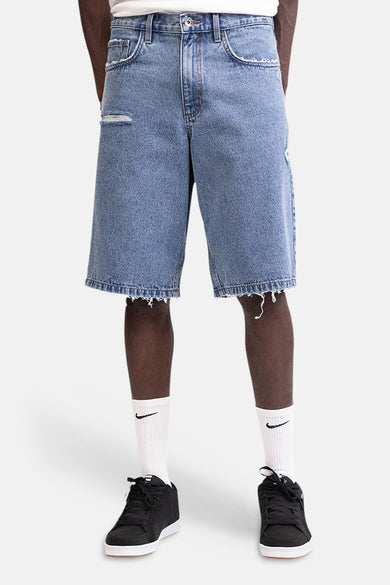 Short en jean bleu moyen de REDEFINED REBEL, vu de dos avec ourlets effilochés et deux poches arrière.