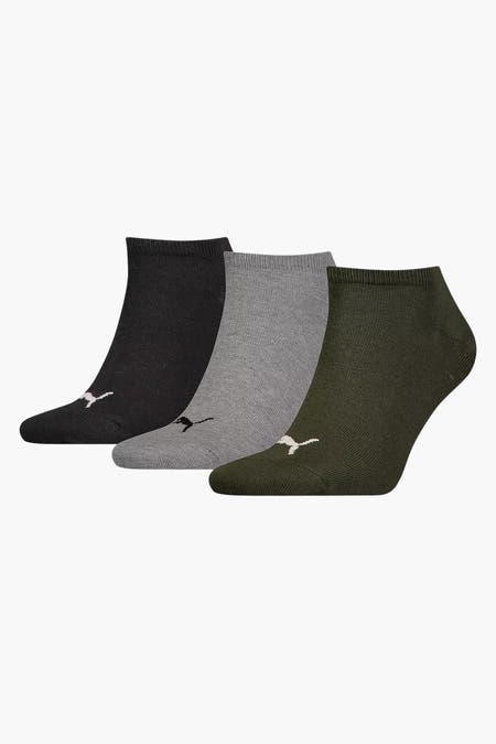 Chaussettes vertes de PUMA, avec un logo brodé sur le genou et des côtes.