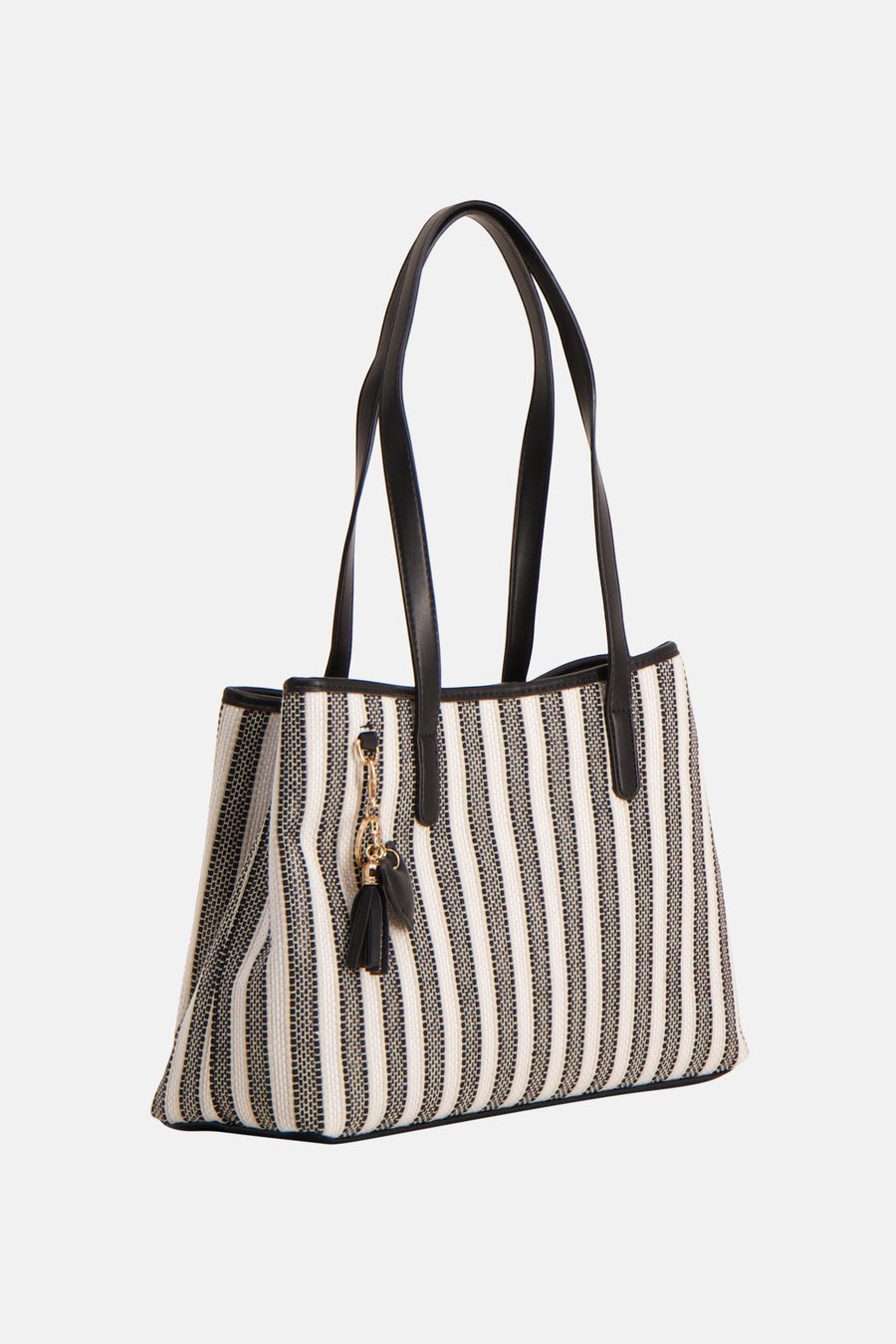 Sac à bandoulière noir de Morgan De Toi, avec un motif rayé et des anses noires, plus un pompon décoratif.