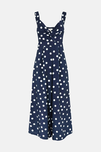 Combinaison bleu marine Morgan De Toi à pois blancs, détail boutonnière au buste et jambes larges.