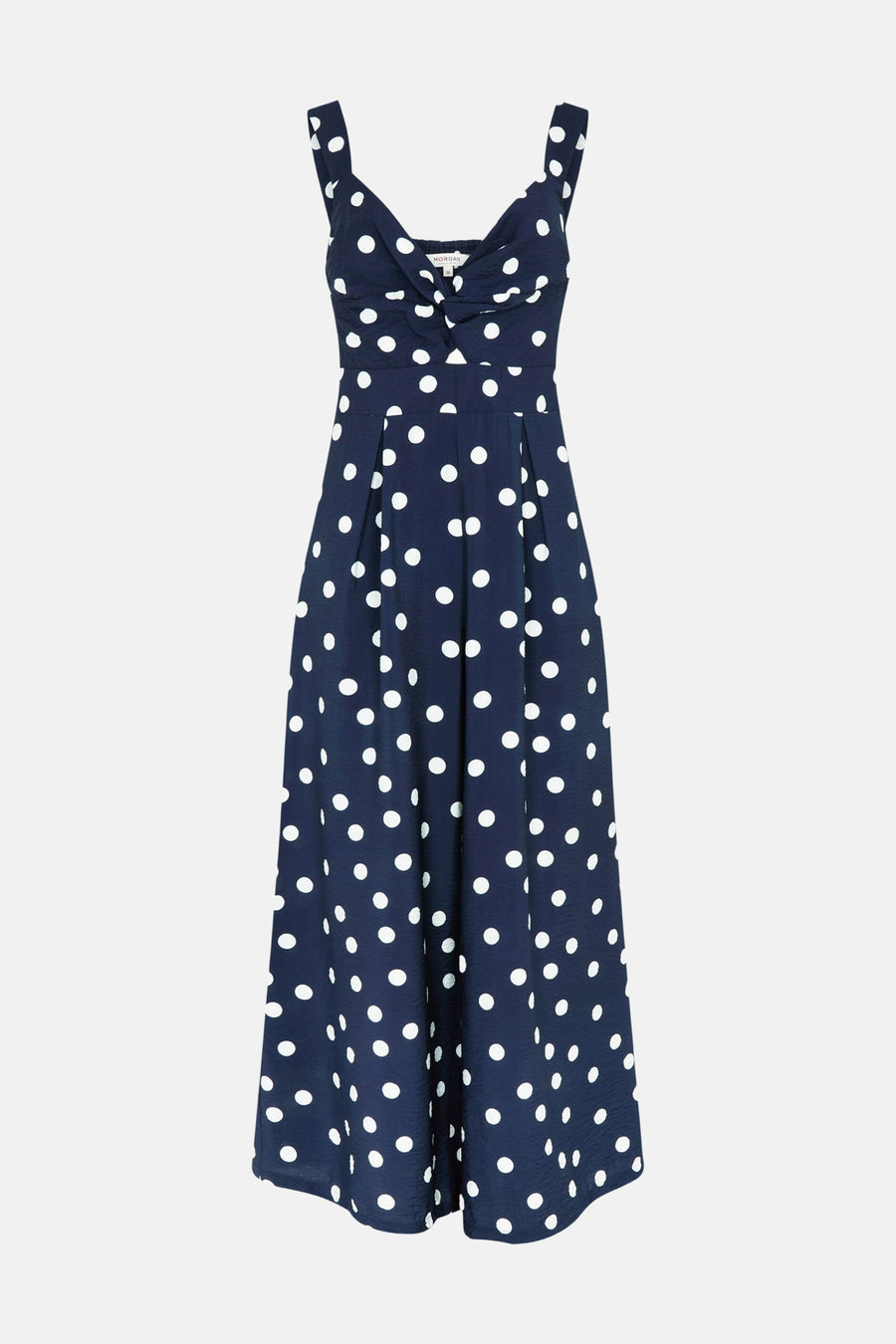 Combinaison bleu marine Morgan De Toi à pois blancs, détail boutonnière au buste et jambes larges.