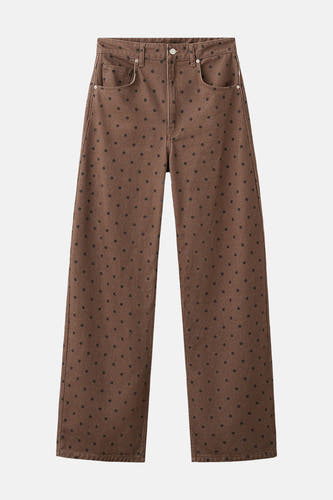 Jean de couleur marron de MANGO avec un motif à pois et des jambes larges.
