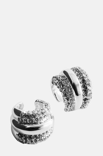 Boucles d'oreilles en argent de MANGO, ornées de petites pierres scintillantes, présentées contre un fond uni.