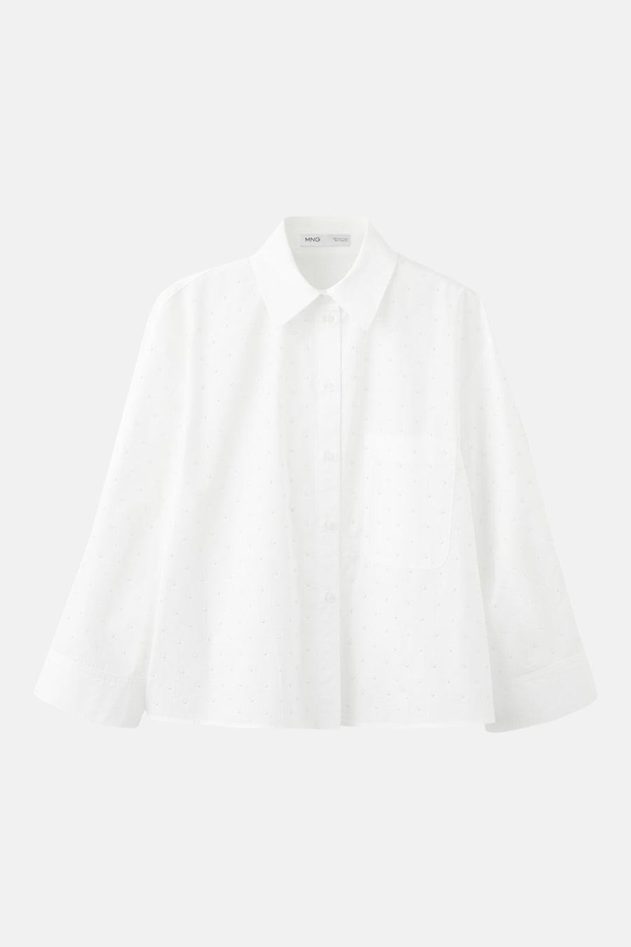 Chemise blanche à manches longues de MANGO, ornée d'un subtil motif à pois et d'une poche poitrine.