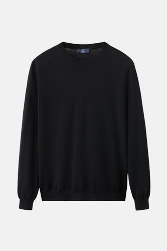 Sweat-shirt noir à col rond de MANGO, couleur unie et manches longues.