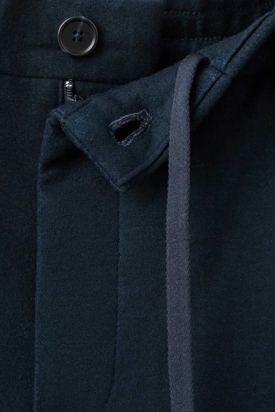 Donkerblauwe wollen broek, knoop en trekkoord.