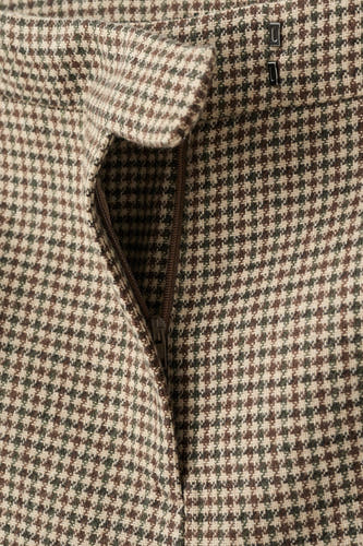Pantalon multicolore de MANGO, avec un motif pied-de-poule et une fermeture éclair.