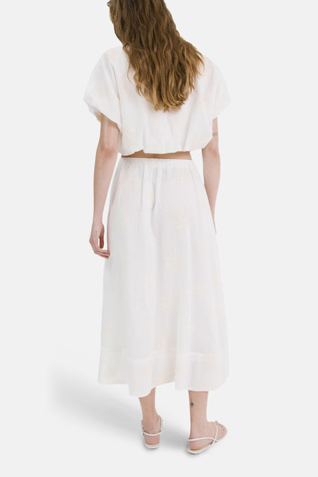 Lange ecru rok van MANGO met subtiele patronen, een elastische tailleband en een losse pasvorm, achterzijde.