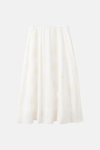 Jupe longue écru de MANGO avec taille élastique et motifs de broderie florale subtils.