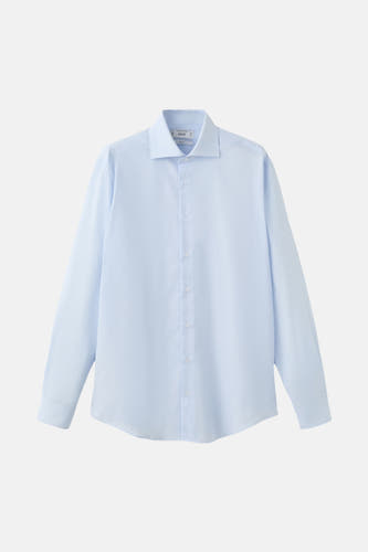 Chemise bleue à manches longues de MANGO, tissu uni et manches longues.