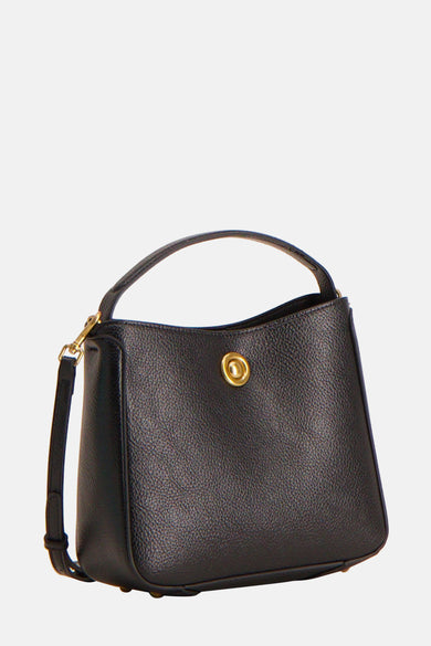 Sac à dos noir de MANGO, avec texture granulée, une courte poignée et une bandoulière amovible.