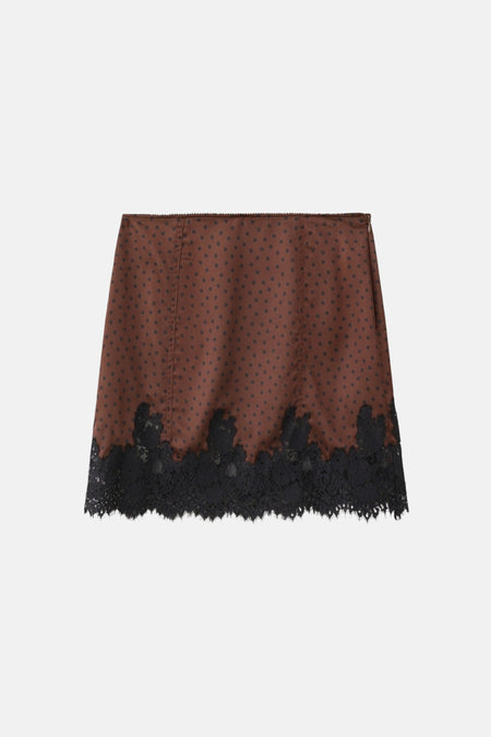 Jupe courte marron de MANGO, à pois noirs et finie avec de la dentelle noire sur le bas.