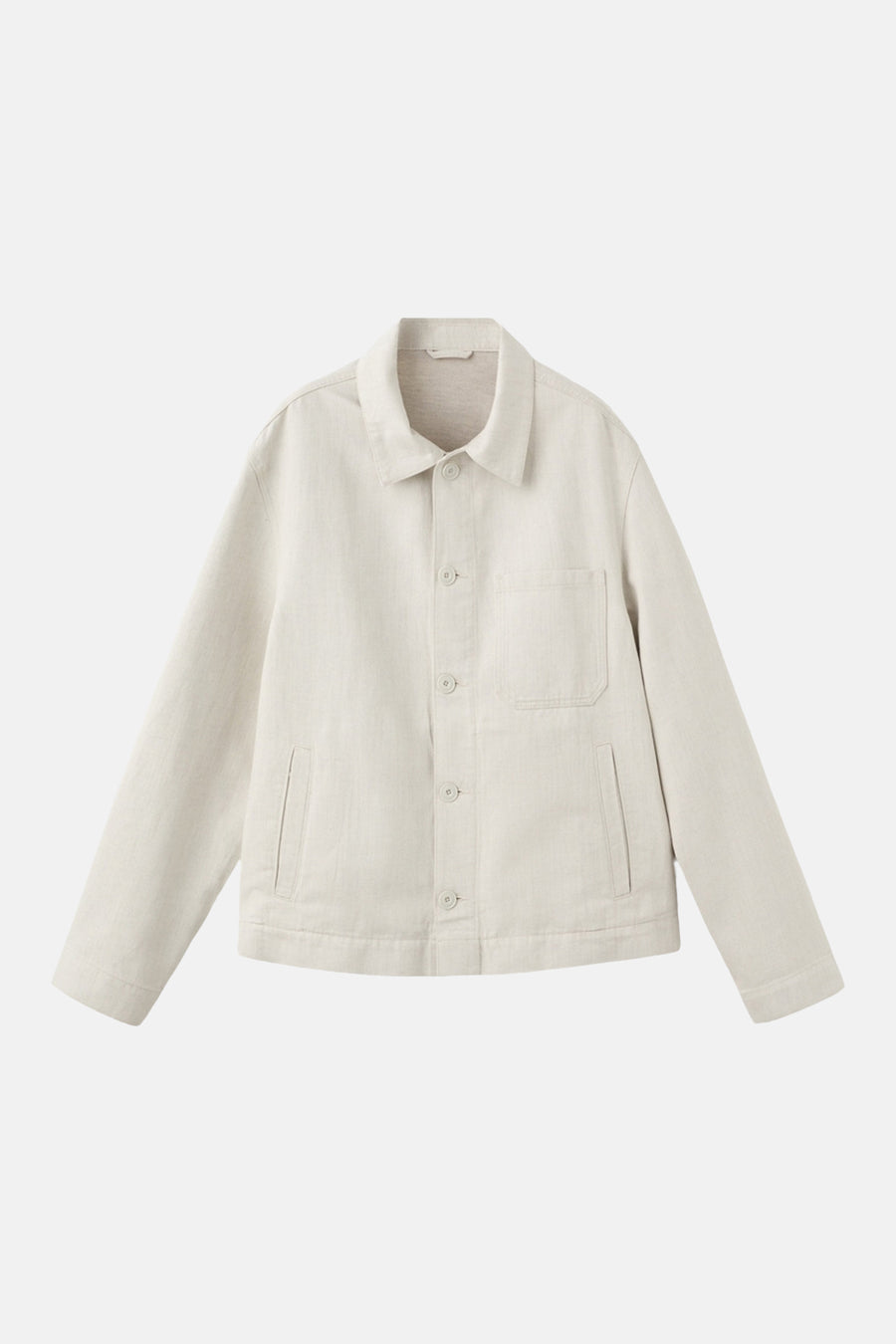 Veste courte écru de MANGO, avec fermeture boutonnée et poches.