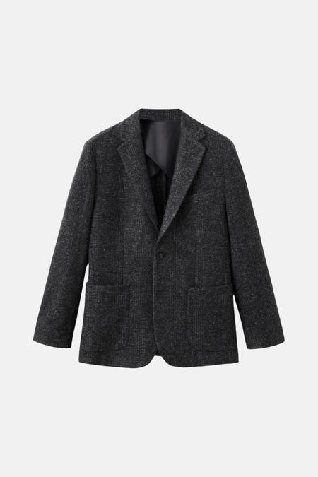 Blazer multicolore de MANGO, avec des manches longues, un col et des poches sur la partie avant.