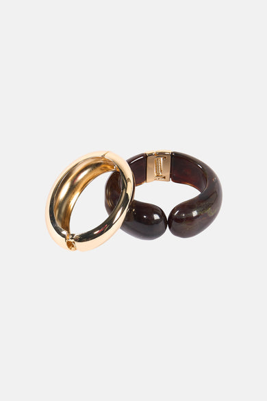 Bracelet multicolore de MANGO, composé d'un anneau doré et d'un anneau brun foncé, en forme de corne.