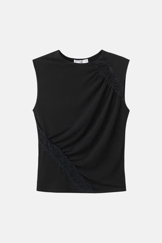 Chemisier noir sans manches de MANGO, avec plis croisés et détails en dentelle.