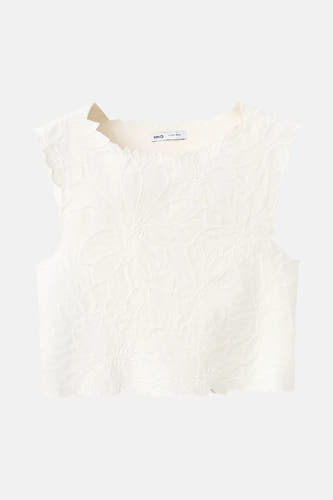 T-shirt sans manches blanc de MANGO avec bords festonnés et motif floral en relief.