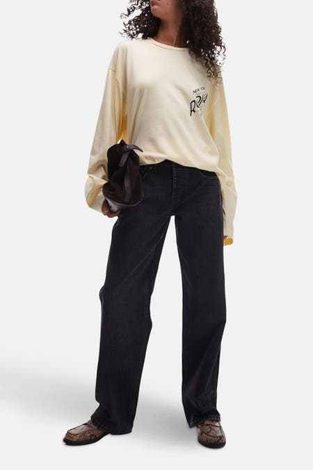 Jean délavé large de TOPSHOP, avec un effet stonewash et des détails cuivrés sur les poches.