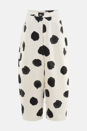 Pantalon écru à pois noirs de TOPSHOP, coupe décontractée à taille haute, fermeture à boutons et poches latérales.