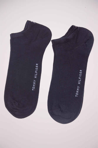 Chaussettes de sneakers bleues de TOMMY JEANS, avec le logo de la marque sur le côté.