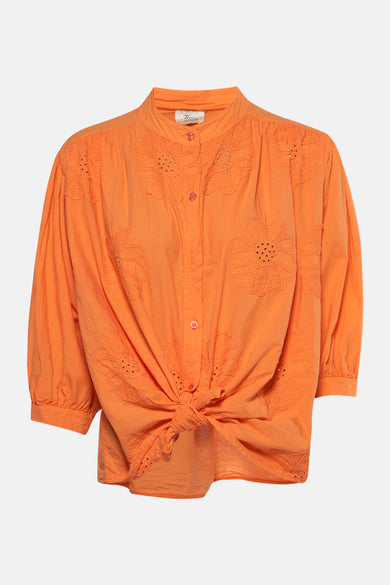 Chemise à manches longues orange de Terra di Siena, avec des détails brodés en motif floral.