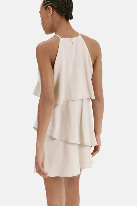 Beige mouwloos kleedje van MANGO, met ruches en open rug, zichtbaar van achteren