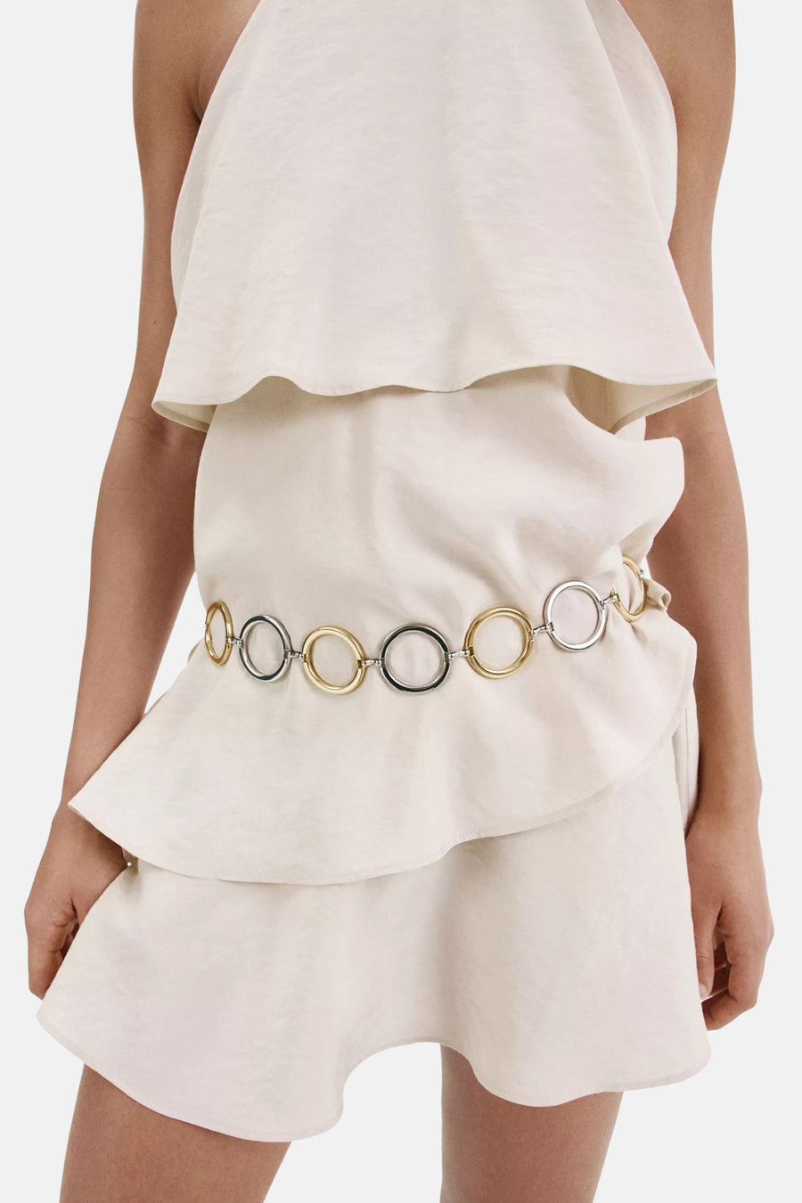 Beige mouwloos kleedje van MANGO met ruches en metalen ringen aan de taille, vooraanzicht