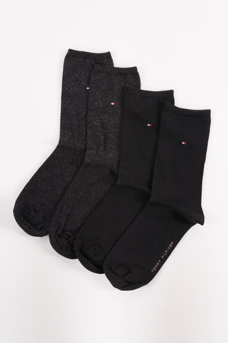 Chaussettes noires de TOMMY JEANS, avec des textures lisses et tachetées.