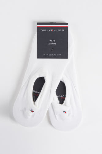 Chaussettes blanches de Tommy Hilfiger avec semelle anti-dérapante et logo.